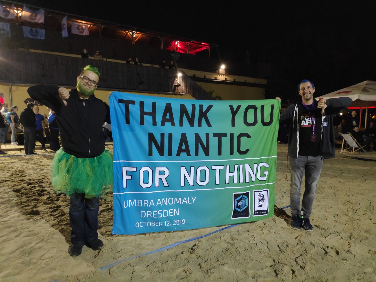 The Enlightened and Resistance POC's in Dresden holding up a banner that reads Thank You Niantic and under that it reads For Nothing