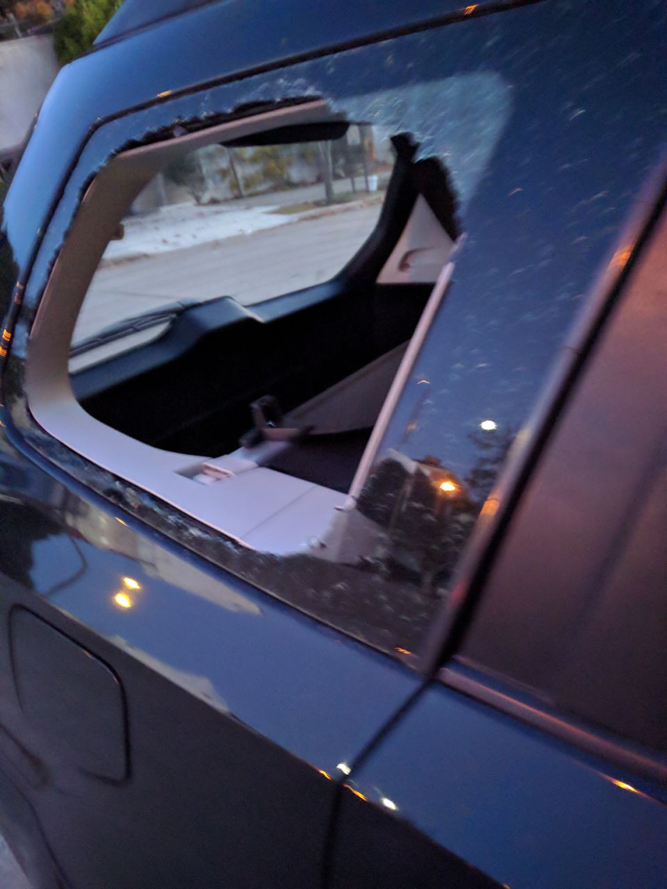 Photo of the rear, passenger side, window of this car owned by a member of The Brokers Guild that was smashed a few hours after the cease and desist letters were announced by Cleaningress.